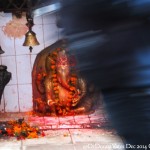 2014.12.09 Kathmandu 82 Citywalk Ganesh passers by ResizeBy Donna Yates CC BY-NC-SA